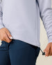 Close-up of the Straight Down Opal Half Zip in Cosmic Blue highlighting the adjustable drawcord hem and textured waffle knit fabric