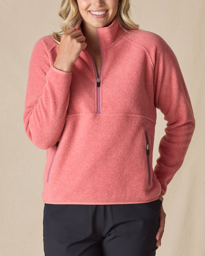 Women's Cerro Quarter Zip in Cedar, front view on model featuring a coral fleece quarter zip pullover with purple zipper accents, paired with black pants