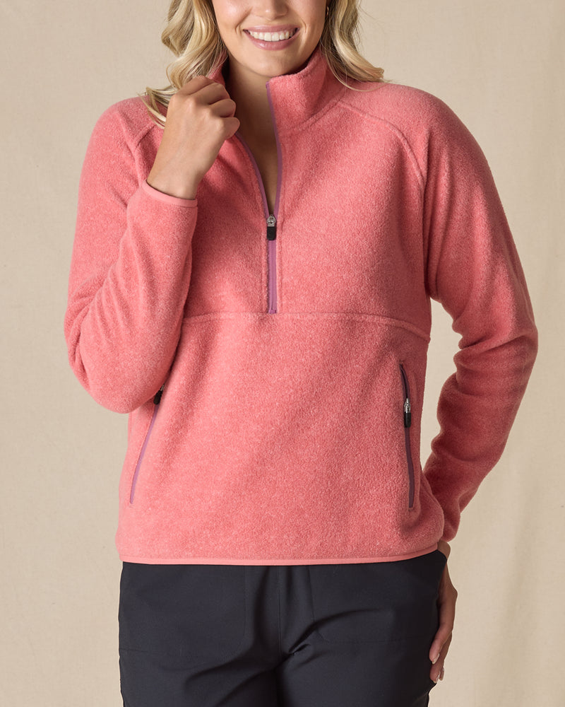 Women's Cerro Quarter Zip in Cedar, front view on model featuring a coral fleece quarter zip pullover with purple zipper accents, paired with black pants
