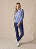 Cerro Quarter Zip in Bluestone, full length on-model view styled with navy ankle pants and white shoes featuring a solid blue-grey fleece quarter-zip pullover with a stand-up collar and light blue contrast zipper