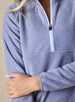 Cerro Quarter Zip in Bluestone, close-up on-model view of the stand-up collar and quarter-zip closure featuring a light blue contrast zipper pull on a soft blue-grey fleece fabric