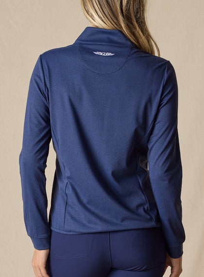 Women's Hera Jacket in New Indigo, back view on model featuring a solid navy knit back with white Straight Down logo at the upper back, paired with matching navy pants