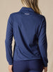 Women's Hera Jacket in New Indigo, back view on model featuring a solid navy knit back with white Straight Down logo at the upper back, paired with matching navy pants