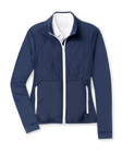 Women's Hera Jacket in New Indigo, flat lay front view featuring a hybrid construction with a quilted diamond-pattern navy front body and solid navy stretch sleeves, full zip white closure, stand-up collar, and zip side pockets with white contrast trim, layered over a white collared shirt