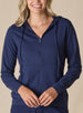 Women's Mesa Hooded Jacket in New Indigo, front model view featuring a navy full-zip hoodie with drawstring hood, center zip closure, and long sleeves paired with matching pants