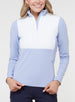Women's Althea Half Zip in Lavender, front view on model featuring a color-blocked white quilted front panel with soft lavender blue knit sleeves and lower body, half-zip stand collar, and zippered side pockets, paired with navy pants
