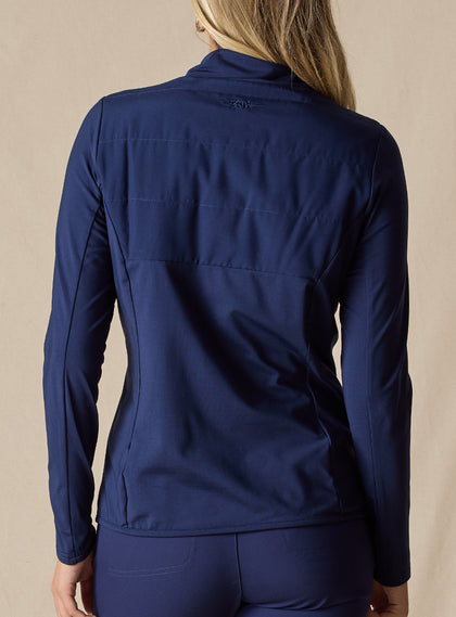 Women's Althea Half Zip in New Indigo, back view on model featuring a tonal navy lightly quilted upper back panel with navy knit lower body and sleeves, and a tonal Straight Down logo at the upper back