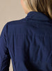 Women's Althea Half Zip in New Indigo, close-up back detail view featuring the tonal navy lightly quilted upper back panel with tonal Straight Down logo and horizontal stitch detailing