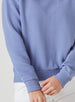 Delia Sweatshirt in Blueberry, close-up detail view featuring the horizontal ribbed texture of the fabric and ribbed knit cuff detail