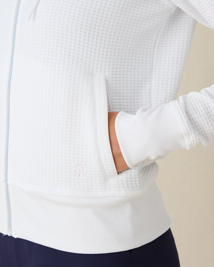 Eliza Hoodie in White, close-up front view on model highlighting the waffle-knit texture, side pocket and Straight Down logo detail