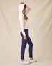 Eliza Hoodie in Pearl, full length front view featuring a blush pink waffle knit full zip hoodie, layered over a white polo and paired with navy ankle pants and white golf shoes