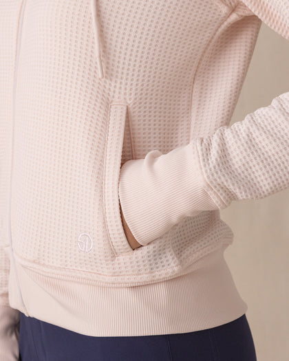 Eliza Hoodie in Pearl, close-up detail view featuring the waffle knit texture, front pocket, and Straight Down embroidered logo