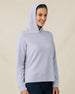 Woman wearing the Daria Hoodie in Cosmic Blue with the hood up