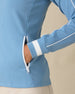 Patty Jacket in Coastal, close-up detail view on model featuring the white zip pocket, white sleeve piping, and white striped cuff detail