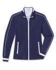 Women's Patty Jacket in New Indigo, flat lay front view featuring a solid navy fabric with white contrast piping along the sleeves, full zip closure, stand collar, dual zip pockets, and white striped cuffs