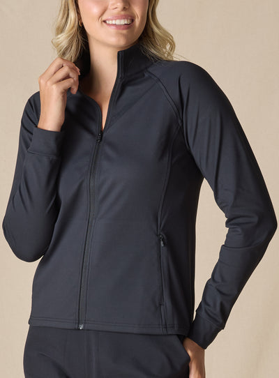 Women's Eirene Jacket in Black, front view on model featuring a solid black performance fabric with a full-zip stand collar and raglan sleeves, with zippered side pocket detail, paired with black pants