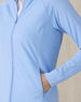 Women's Eirene Jacket in Carolina, detail close-up view featuring a light blue full-zip jacket highlighting the center front zipper, seam detailing, and zippered side pocket with model's hand inside pocket
