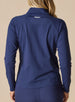 Women's Eirene Jacket in New Indigo, back view on model featuring a solid navy performance fabric with raglan sleeve construction and white Straight Down logo at the upper back, paired with matching navy pants