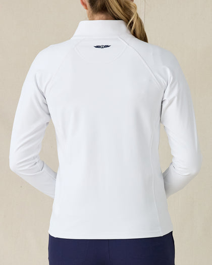 Women's Eirene Jacket in White, back view on model featuring a clean white performance fabric with raglan sleeve construction and navy Straight Down logo at the upper back, paired with navy pants