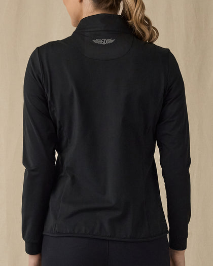 Women's Ida Hybrid Jacket in Black, back view on model featuring a black full zip jacket with a smooth back panel and Straight Down logo at the upper back, paired with black pants