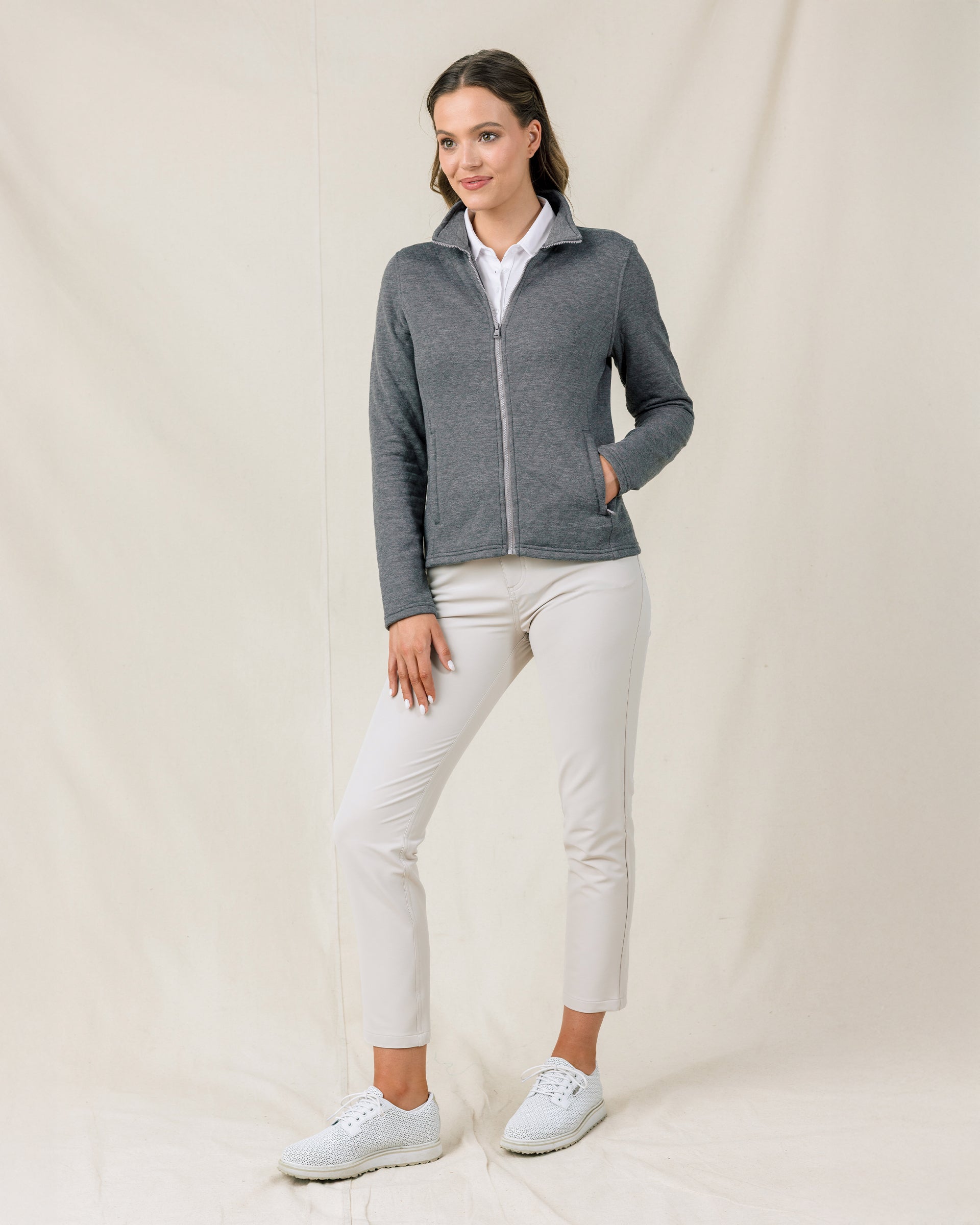 Full-length front view of a model wearing the Marlow Jacket in Nightshade zipped with one hand in the front pocket.