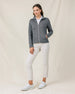 Full-length front view of a model wearing the Marlow Jacket in Nightshade zipped with one hand in the front pocket.