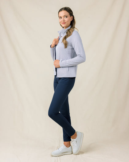 Side view of a woman wearing the Marlow Jacket in Cosmic Blue with a quilted finish