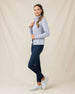Side view of a woman wearing the Marlow Jacket in Cosmic Blue with a quilted finish