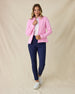 Marlow Jacket in Pink Floyd, full-length front view on model in solid pink diamond quilt texture with zip open, layered over a white polo, paired with navy pants and white golf shoes