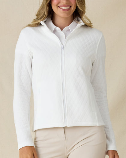 Women's Marlow Jacket in White, front view on model featuring a full-zip closure and diamond quilted texture pattern, styled with a white collared shirt and khaki pants