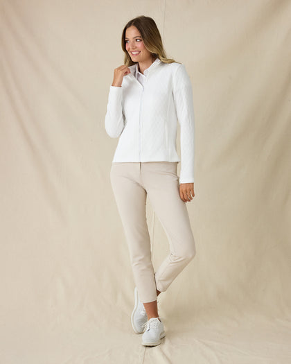 Women's Marlow Jacket in White, full-length side view on model featuring a full-zip closure and diamond quilted texture pattern, styled with a white collared shirt, khaki pants, and white shoes