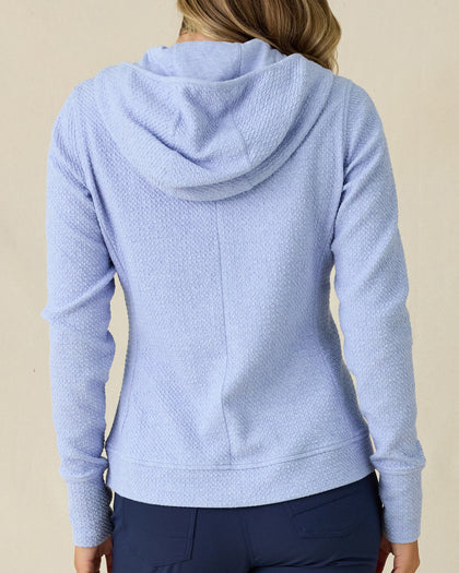 Highland Hooded Jacket in Blue Heather, back view on model in solid light blue textured fleece with hood, paired with navy pants