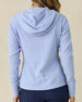 Highland Hooded Jacket in Blue Heather, back view on model in solid light blue textured fleece with hood, paired with navy pants