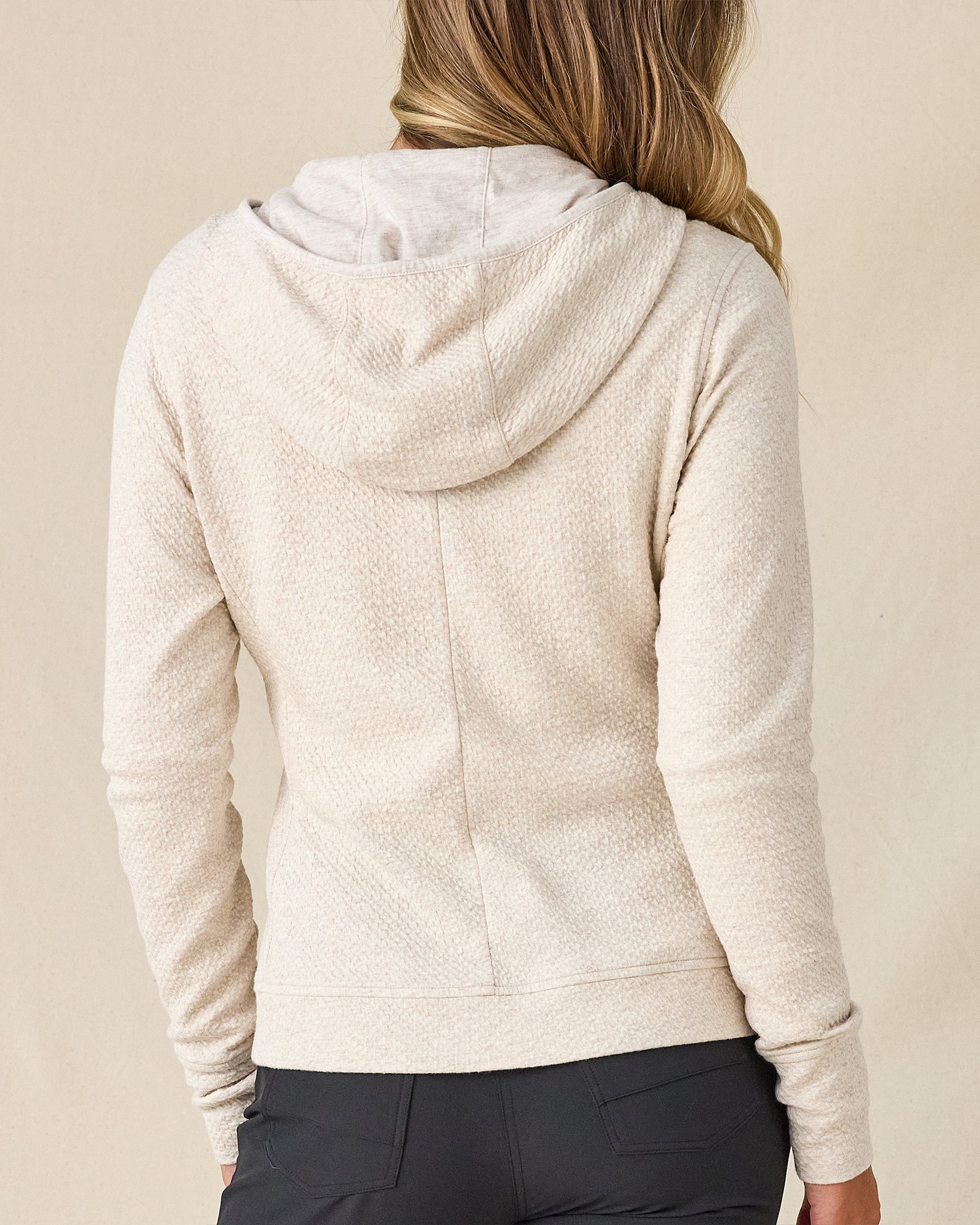 Highland Hooded Jacket in Oatmeal Heather, back view on model featuring an oatmeal heather textured fleece full zip hooded jacket, paired with charcoal pants