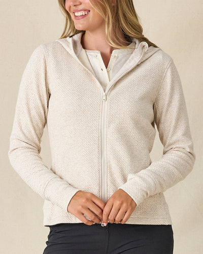 Highland Hooded Jacket in Oatmeal Heather, front view on model featuring an oatmeal heather textured fleece full zip hooded jacket, layered over a white polo and paired with charcoal pants