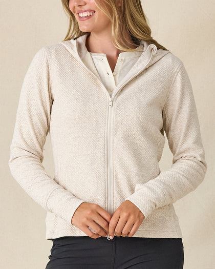 Highland Hooded Jacket in Oatmeal Heather, front view on model featuring an oatmeal heather textured fleece full zip hooded jacket, layered over a white polo and paired with charcoal pants