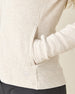 Highland Hooded Jacket in Oatmeal Heather, close-up detail view on model featuring the textured fleece fabric, side pocket, and Straight Down embroidered logo