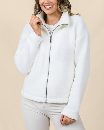 Model wearing the Kemble Fleece Jacket in Coconut with a relaxed fit, plush fleece, and full-zip front