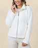 Model wearing the Kemble Fleece Jacket in Coconut with a relaxed fit, plush fleece, and full-zip front