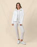 Model wearing the Kemble Fleece Jacket in Coconut unzipped over a knit top