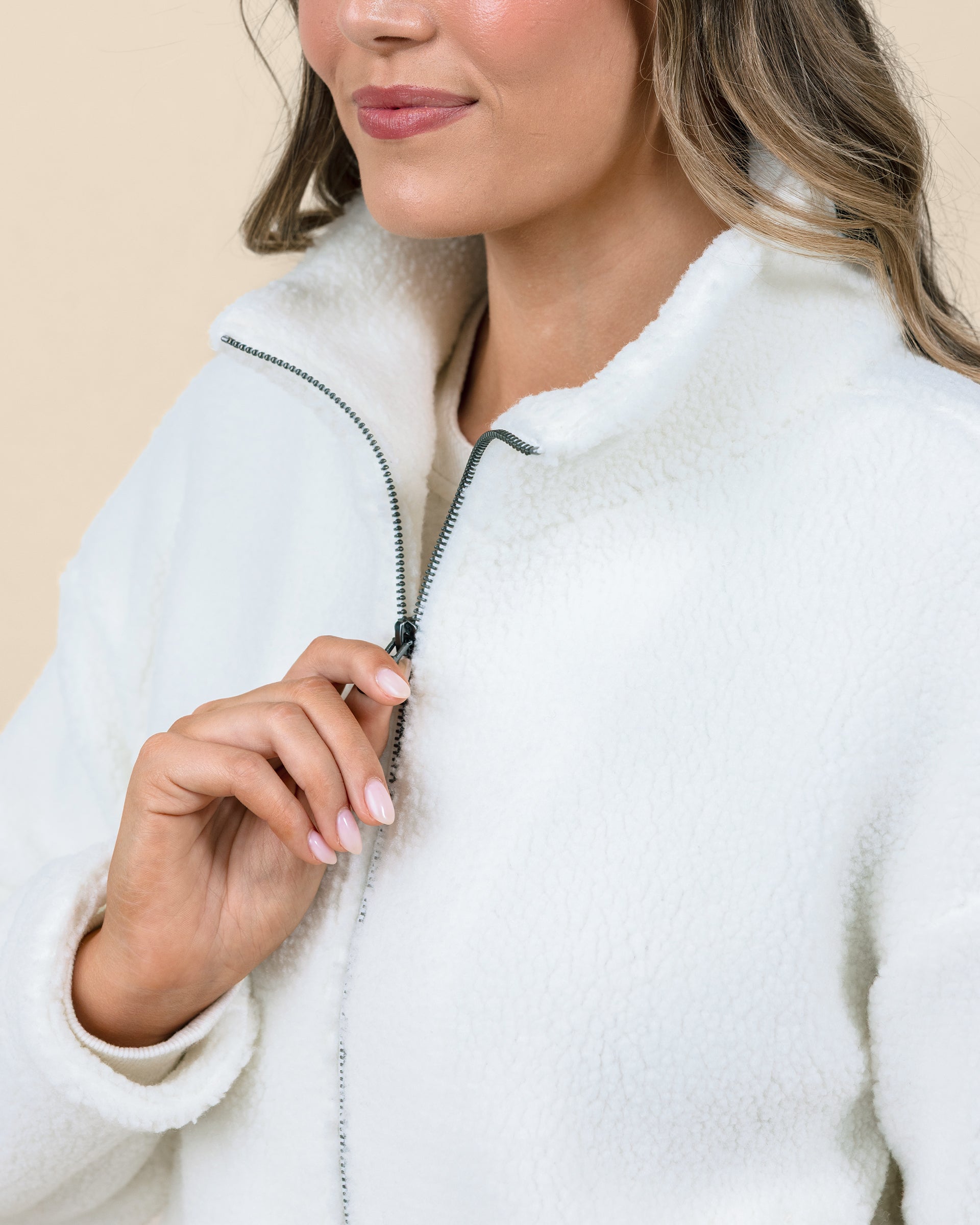Close-up of the Kemble Fleece Jacket in Coconut highlighting the full-zip closure and soft high-pile fleece texture