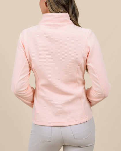 Back view of a model wearing the New Swing Jacket in Melba, highlighting the textured fabric, contrast side panels, and fitted silhouette.