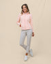 Full-length front view of a model wearing the New Swing Jacket in Melba zipped with one hand in the front pocket.