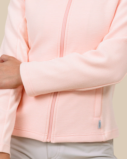 Detail view of the New Swing Jacket in Melba highlighting the ribbed texture, full-zip front, and pocket detailing.