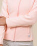 Detail view of the New Swing Jacket in Melba highlighting the ribbed texture, full-zip front, and pocket detailing.