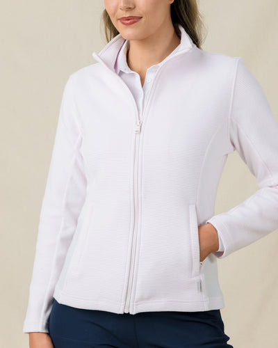 Woman wearing the Straight Down New Swing Jacket in Pale Pink with a full-zip front