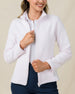 Close-up of the Straight Down New Swing Jacket in Pale Pink worn unzipped over a white polo, showcasing the ribbed texture