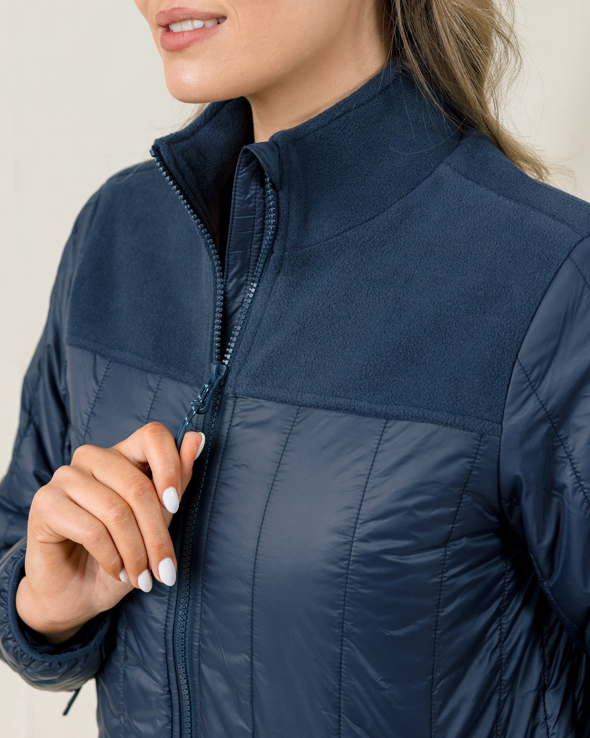Close-up of the Taylor Jacket in New Indigo showing the fleece stand collar and full-zip front