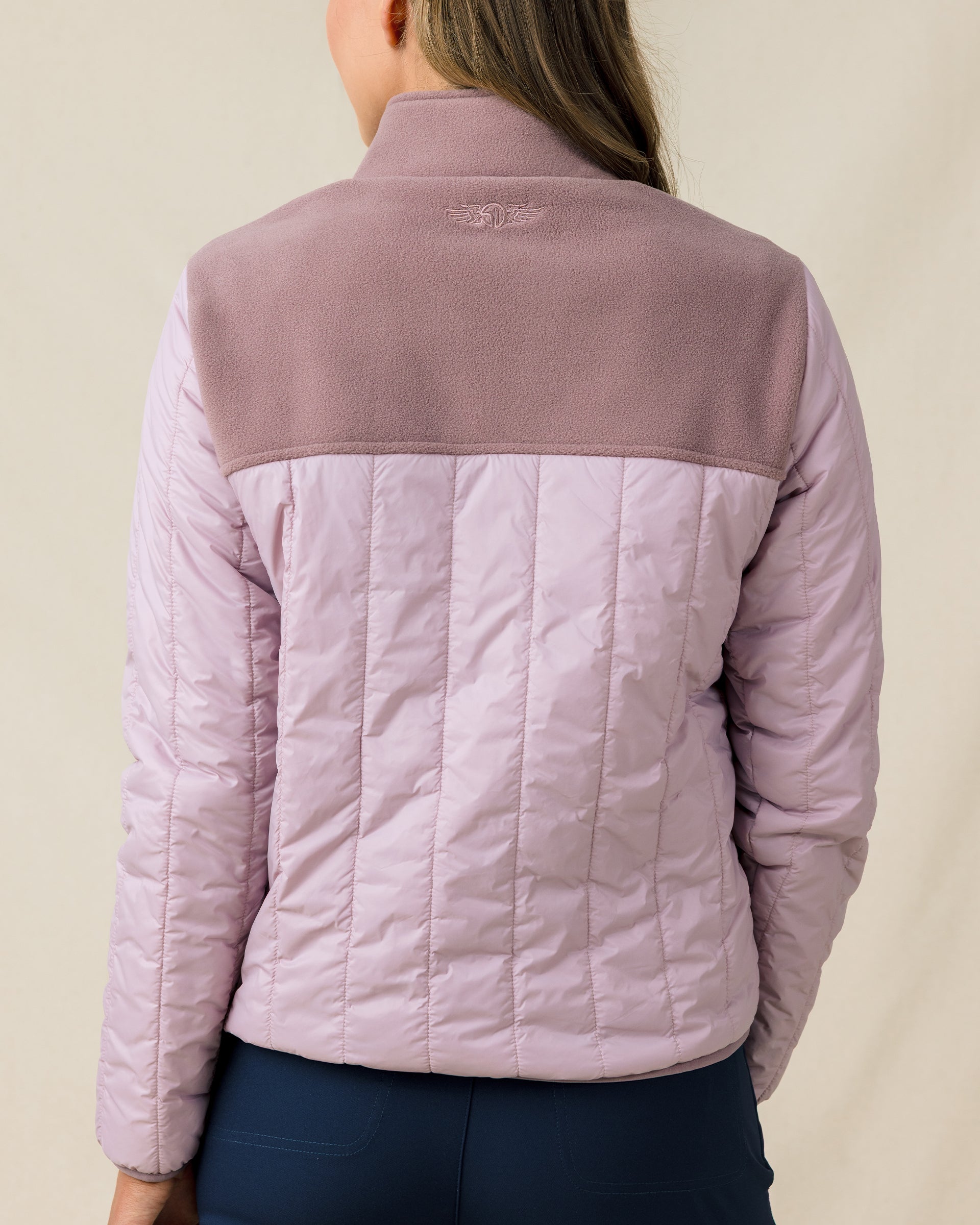 Back view of the Taylor Jacket in Pink Dawn featuring a quilted back panel and fleece yoke