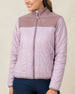 Model wearing the Taylor Jacket in Pink Dawn with a lightweight quilted design, fleece yoke, and full-zip front